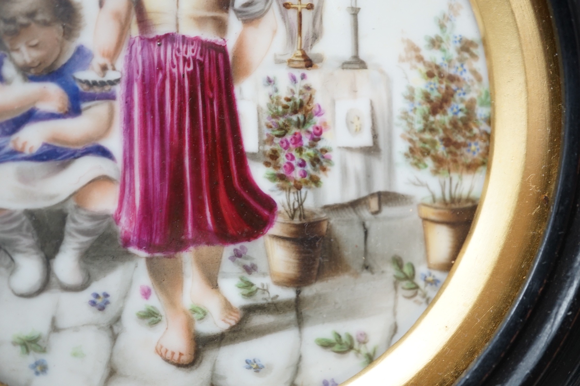 A 19th century Continental porcelain plaque. 16cm diameter overall